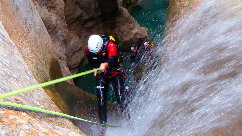 Person abseiling into water