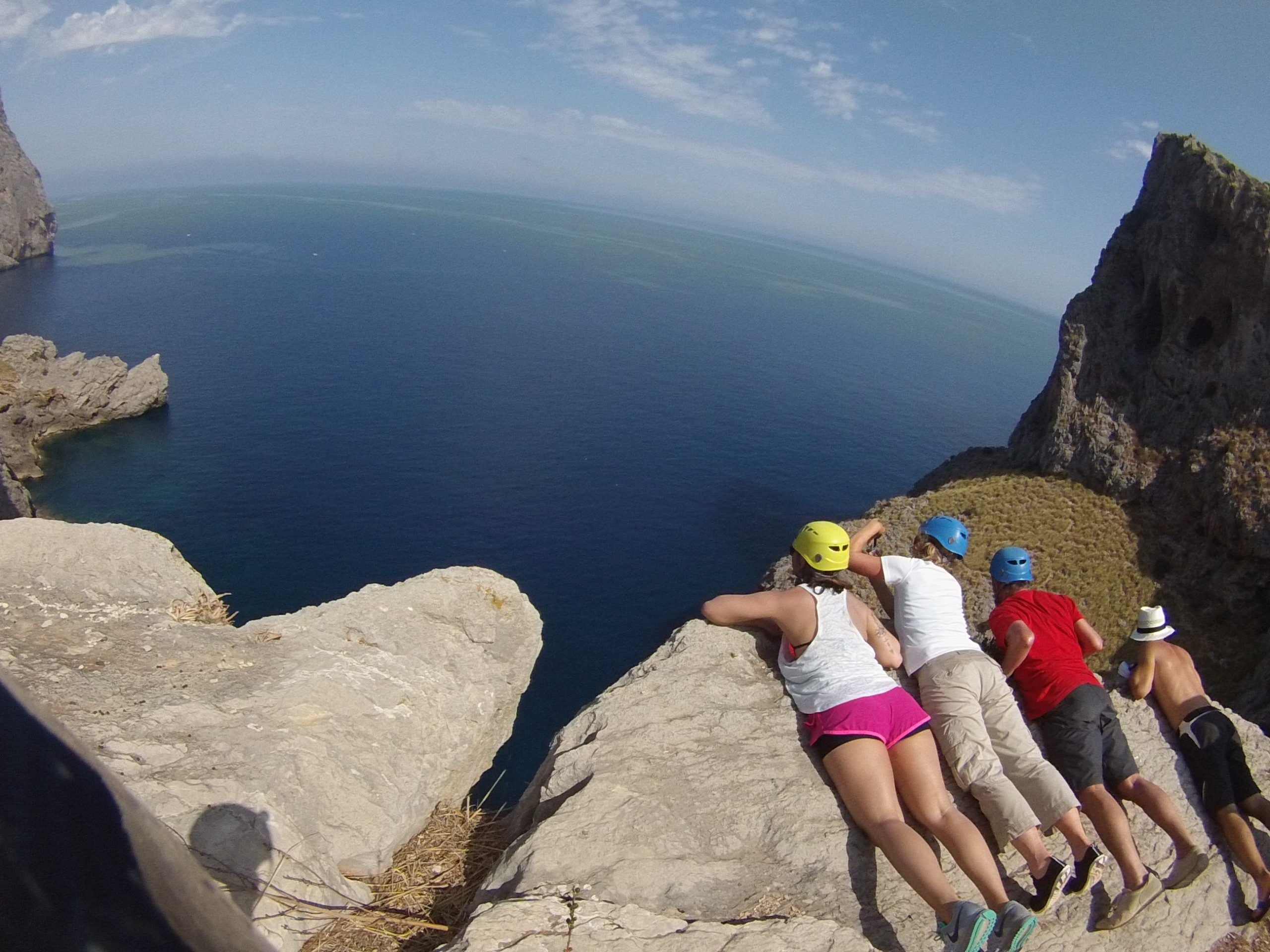 People on the edge of a cliff in Majorca