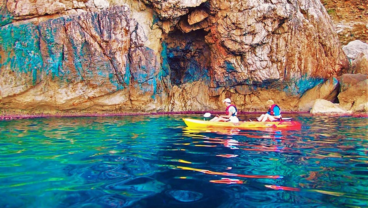 Two people on 1 kayak during their majorca activity holidays