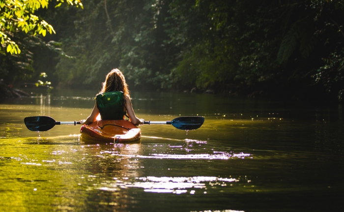 A woman kayaking on River Wye