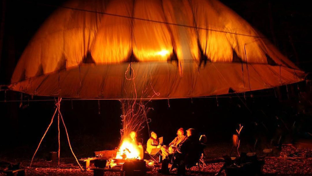 Canopy campfire during an overnight wild camping adventure.