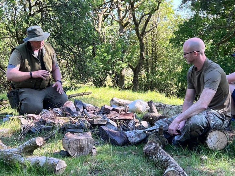 Two men in a wild camping adventure for their stag do activity in Cardiff