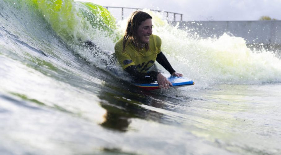 Woman enjoying bodyboarding activity in Wales