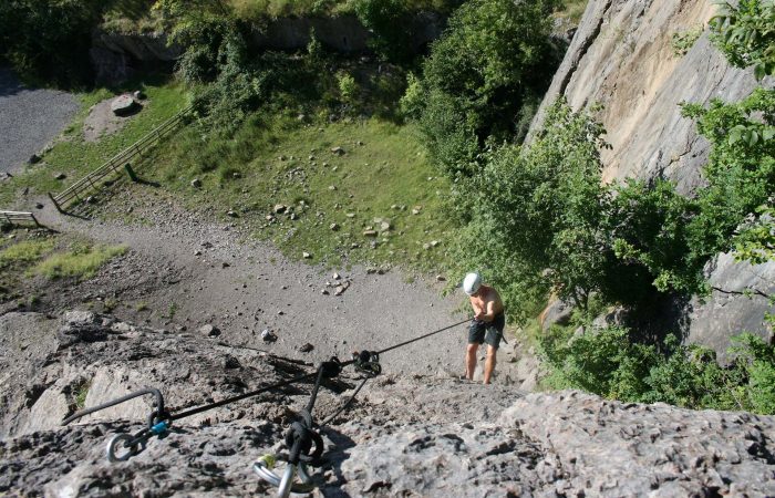 A man abseiling in South Wales