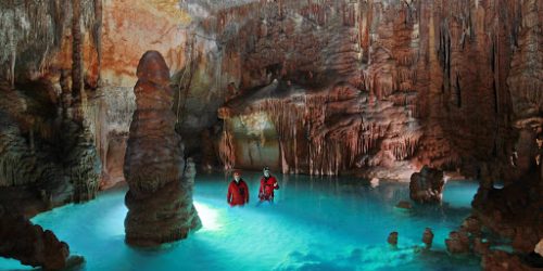 People swimming inside a cave in Majorca