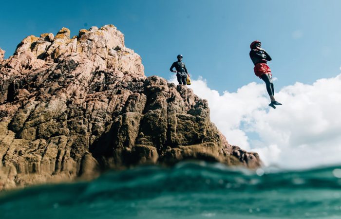 people jumping in water