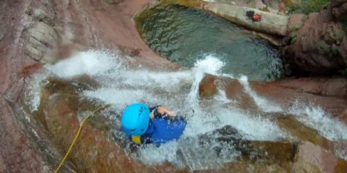 A person canyoning in France