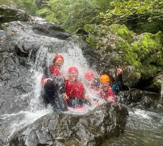 gorge walking action shot of waterfall in Wales