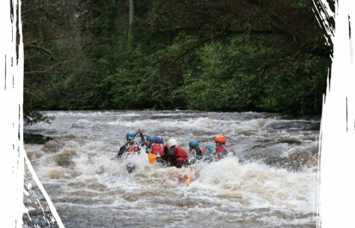 Group of people on a white water rafting adventure